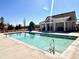 View of the community pool with a bathhouse and patio furniture at 4527 Moray Dr, Mableton, GA 30126