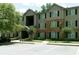 Attractive apartment building featuring stone accents and lush landscaping at 5101 Fairington Club Dr, Lithonia, GA 30038