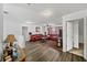 Spacious living room area features hardwood floors, a ceiling fan, and comfortable furniture at 5770 Millstone Dr, Cumming, GA 30028