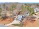 Aerial view of the home with a long driveway, surrounded by mature trees at 5073 Hyacinth Ln, Austell, GA 30106