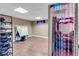 View of the finished basement with wood-look floors and ample storage space at 5073 Hyacinth Ln, Austell, GA 30106