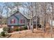 Charming two-story home featuring red shutters, a brick foundation, and a landscaped front yard at 5073 Hyacinth Ln, Austell, GA 30106