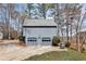 Detached two-car garage with gray siding and well-maintained landscaping at 5073 Hyacinth Ln, Austell, GA 30106