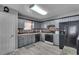 The kitchen features gray cabinets, stainless steel appliances, and light-colored flooring at 5073 Hyacinth Ln, Austell, GA 30106