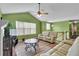 Bright living room with vaulted ceilings, a fireplace, wood-look flooring, and neutral-toned furniture at 5073 Hyacinth Ln, Austell, GA 30106