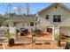 Large back deck with outdoor dining and seating areas, perfect for relaxing at 673 Waters Rd, Hiram, GA 30141