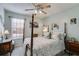 Inviting bedroom featuring a four-poster bed, bedside tables, and a decorative color scheme at 673 Waters Rd, Hiram, GA 30141