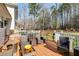 Spacious deck with ample seating for entertaining, overlooking a wooded backyard at 673 Waters Rd, Hiram, GA 30141