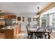 Charming dining area with a breakfast bar, ample natural light, and a view to the exterior at 673 Waters Rd, Hiram, GA 30141