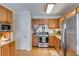 Well-lit kitchen featuring stainless steel appliances, granite countertops, and wooden cabinetry at 673 Waters Rd, Hiram, GA 30141