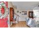 Inviting living room with hardwood floors, a bright red door and staircase at 673 Waters Rd, Hiram, GA 30141