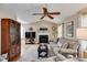 Comfortable living room with a fireplace and vaulted ceiling, bathed in natural light at 673 Waters Rd, Hiram, GA 30141