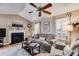 Living room with vaulted ceiling, fireplace, and a large window with plenty of natural light at 673 Waters Rd, Hiram, GA 30141