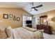 Relaxing bedroom featuring a ceiling fan, matching dresser, and stylish décor at 673 Waters Rd, Hiram, GA 30141