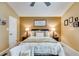 Warm bedroom with a comfortable bed, bedside tables, and framed photos adorning the walls at 673 Waters Rd, Hiram, GA 30141