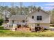 The home's rear exterior highlights a spacious deck and well-maintained backyard at 673 Waters Rd, Hiram, GA 30141