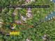 Aerial view showing property lines and location of home surrounded by trees at 7640 Harbour Walk, Cumming, GA 30041