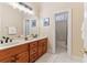 Bright bathroom with double sinks, ample counter space, and a separate shower at 7640 Harbour Walk, Cumming, GA 30041