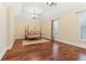 Spacious bedroom featuring a tray ceiling, hardwood floors, and light-filled windows at 7640 Harbour Walk, Cumming, GA 30041