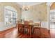 Bright dining room featuring hardwood floors, chandelier and decorative wall textures at 7640 Harbour Walk, Cumming, GA 30041
