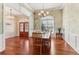 Dining room features hardwood floors, large windows, with natural light and ample seating at 7640 Harbour Walk, Cumming, GA 30041