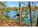 This lakefront property features a private dock with a boat lift, perfect for enjoying water activities at 7640 Harbour Walk, Cumming, GA 30041