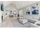 Open-concept living room featuring a fireplace, neutral decor and view to kitchen with large island at 7640 Harbour Walk, Cumming, GA 30041