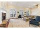 Spacious living room with fireplace, large windows and hardwood flooring at 7640 Harbour Walk, Cumming, GA 30041