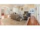 Open concept living room with stone fireplace, built-ins, and lots of natural light at 7640 Harbour Walk, Cumming, GA 30041