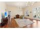 Inviting living room with hardwood floors, natural light, and comfortable seating at 7640 Harbour Walk, Cumming, GA 30041