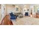 Bright living room featuring hardwood floors, staircase, and neutral color palette at 7640 Harbour Walk, Cumming, GA 30041