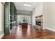 Inviting office space featuring custom built-ins, a stone fireplace, and a large window offering natural light at 7640 Harbour Walk, Cumming, GA 30041