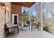 Relaxing outdoor patio with comfortable seating and a scenic view of the surrounding landscape at 7640 Harbour Walk, Cumming, GA 30041