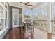 Covered porch featuring outdoor seating with view to the natural landscape at 7640 Harbour Walk, Cumming, GA 30041