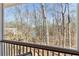 Outdoor porch view to the surrounding wooded landscape at 7640 Harbour Walk, Cumming, GA 30041