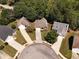 Aerial view of the neighborhood, surrounded by lush greenery, in a suburban setting at 1152 Strath Clyde Way, Mcdonough, GA 30253
