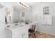 Bright bathroom with a dual sink vanity, a large mirror, and a glass shower at 1152 Strath Clyde Way, Mcdonough, GA 30253