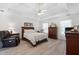 Spacious bedroom featuring tray ceilings, hardwood flooring, and ample natural light at 1152 Strath Clyde Way, Mcdonough, GA 30253