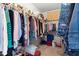 Walk-in closet with shelving on both sides and space for storage bins at 1152 Strath Clyde Way, Mcdonough, GA 30253