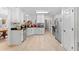 Spacious kitchen with white cabinets, stainless steel appliances, and ample counter space, perfect for cooking and entertaining at 1152 Strath Clyde Way, Mcdonough, GA 30253