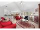 Inviting living room with vaulted ceilings, a brick fireplace, and large windows that fill the room with natural light at 1152 Strath Clyde Way, Mcdonough, GA 30253