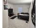 Cozy bedroom with a black bed, entertainment center, and a bright window for natural light at 1644 Alexandria Ct, Marietta, GA 30067
