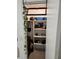 Organized closet space with shelving, hanging space, and overhead storage at 1644 Alexandria Ct, Marietta, GA 30067