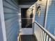 Close-up of the exterior door, decorated with floral accents and featuring a storm door at 1644 Alexandria Ct, Marietta, GA 30067