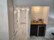 Bright hallway featuring a wet bar and white doors at 1644 Alexandria Ct, Marietta, GA 30067