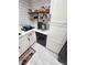 Modern kitchen with white cabinets, stainless steel appliances, and open shelving at 1644 Alexandria Ct, Marietta, GA 30067
