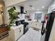 Bright kitchen with white subway tile, open shelving, and modern appliances at 1644 Alexandria Ct, Marietta, GA 30067