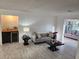 Bright living room with modern furnishings, wood floors, and bar area at 1644 Alexandria Ct, Marietta, GA 30067