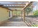 Relaxing backyard patio with stone floors, outdoor grill, ceiling fan, and wooden pergola at 1767 Wingard Dr, Marietta, GA 30062
