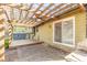 Spacious backyard patio with a wooden pergola, stone floors and outdoor grill perfect for entertaining at 1767 Wingard Dr, Marietta, GA 30062